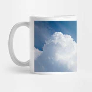 Rising storm cloud and blue sky Mug